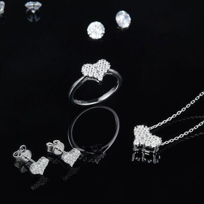 a collection of jewelry on a black background