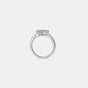 a three stone diamond ring on a white background