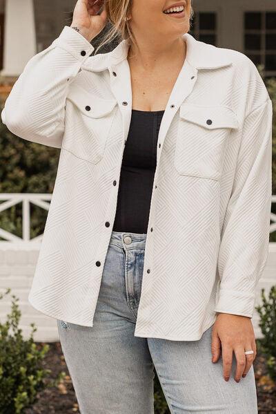 a woman in a white jacket talking on a cell phone