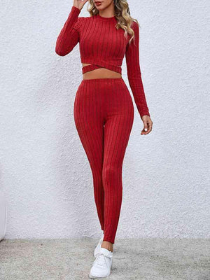 a woman wearing a red two piece set
