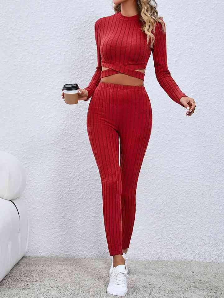 a woman in a red outfit holding a cup of coffee