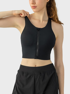 a woman wearing a black sports bra top