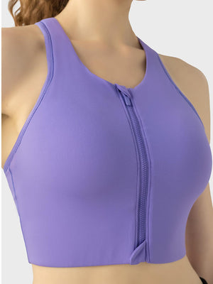 a woman wearing a purple sports bra top