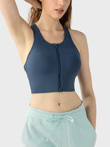 a woman wearing a blue sports bra top