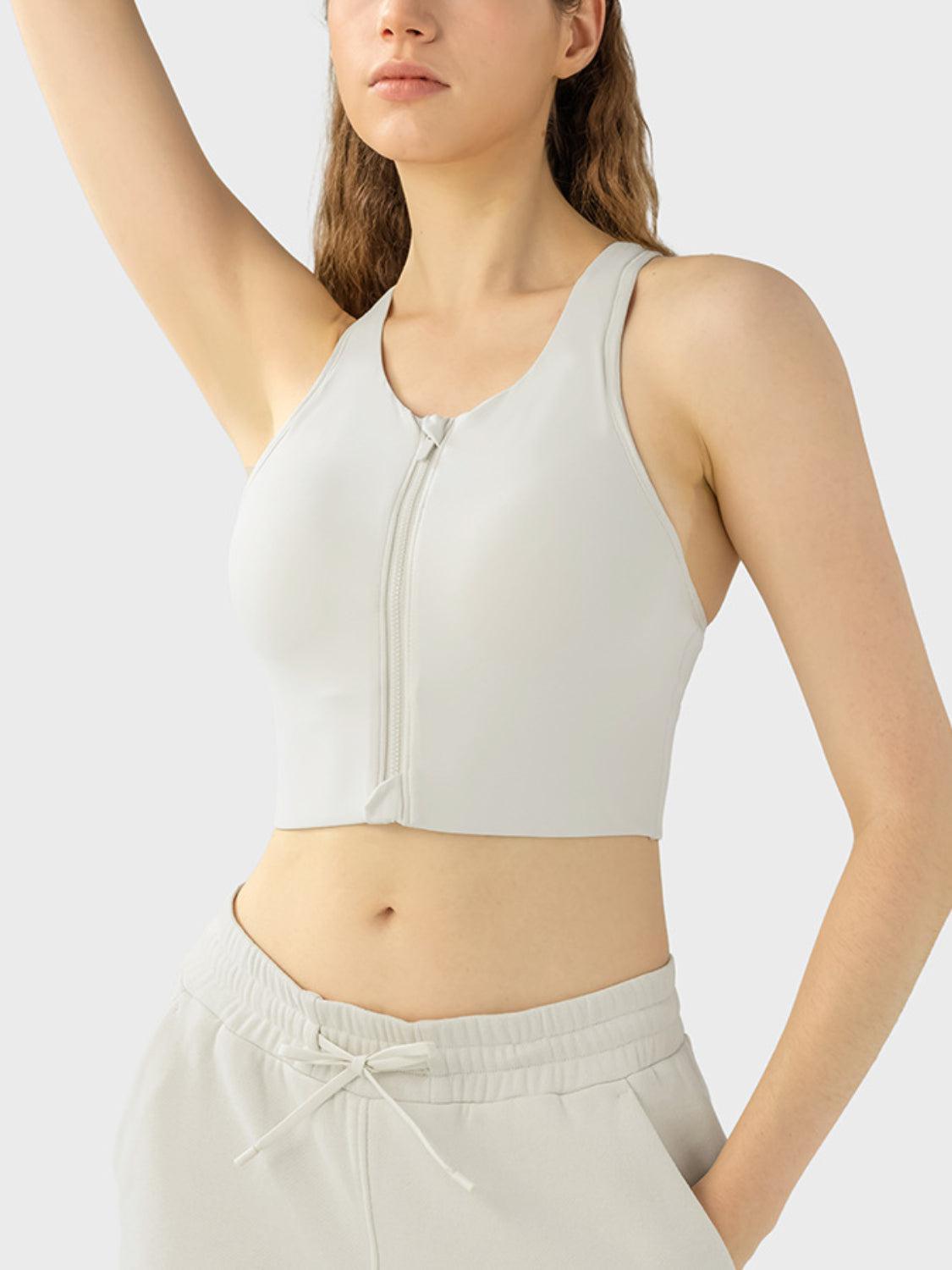 a woman wearing a white sports bra top