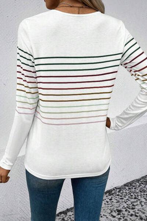 a woman wearing a white striped sweater