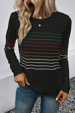 a woman wearing a black striped sweater