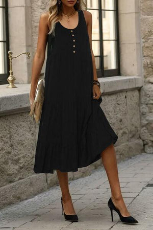 a woman wearing a black dress and heels