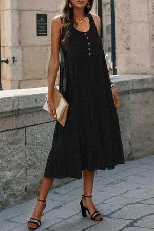 a woman wearing a black dress and heels