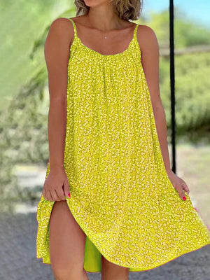a woman in a yellow dress posing for a picture