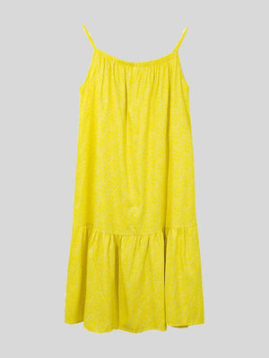 a yellow dress hanging on a hanger