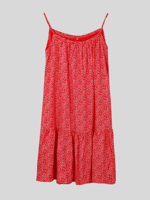 a red dress with a floral pattern on it