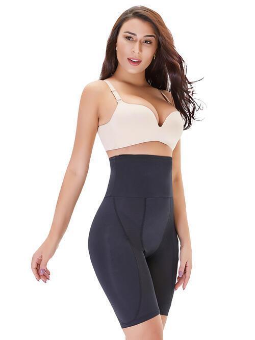 a woman wearing a black and white bodysuit