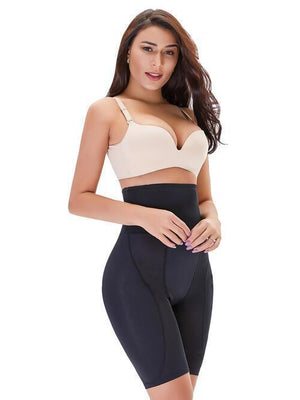 a woman wearing a bra top and tight pants
