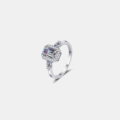 a white gold ring with a baguette cut diamond