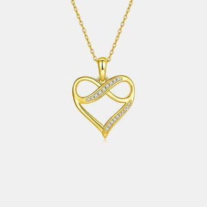 a heart shaped pendant with diamonds on a chain