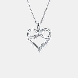 a heart shaped pendant with diamonds on a chain