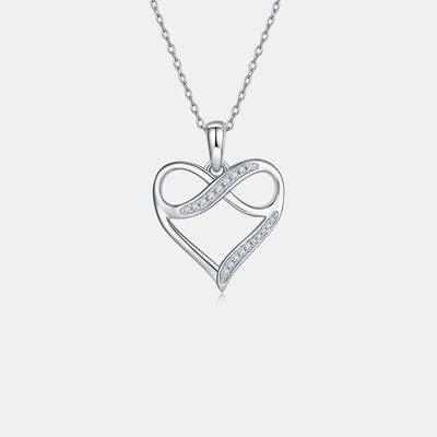 a heart shaped pendant with diamonds on a chain