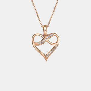 a heart shaped pendant with diamonds on a chain