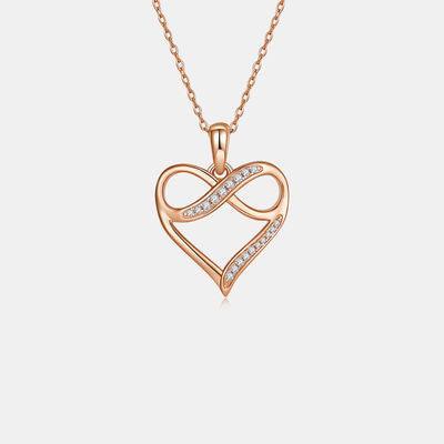 a heart shaped pendant with diamonds on a chain