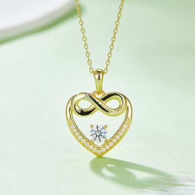 a heart shaped pendant with a diamond in the center