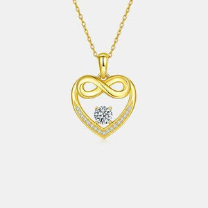 a heart shaped pendant with a diamond in the center