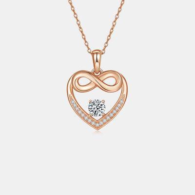 a heart shaped pendant with a diamond in the center
