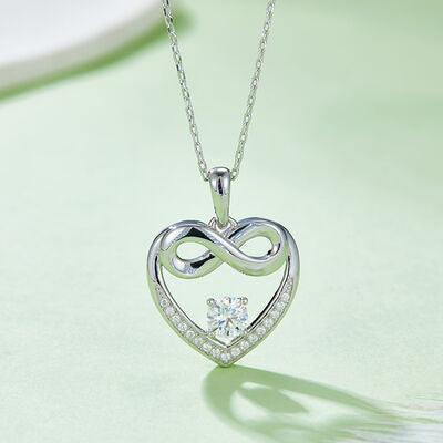 a heart shaped diamond pendant on a chain