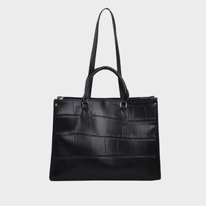 a black handbag on a white background