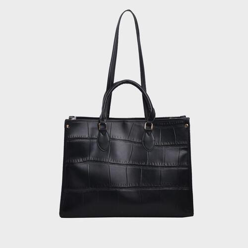 a black handbag on a white background