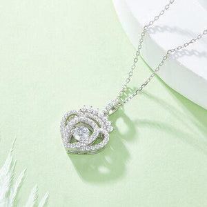 a diamond heart pendant on a chain