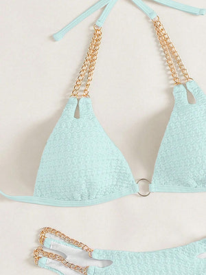 a bikini top with chains attached to it