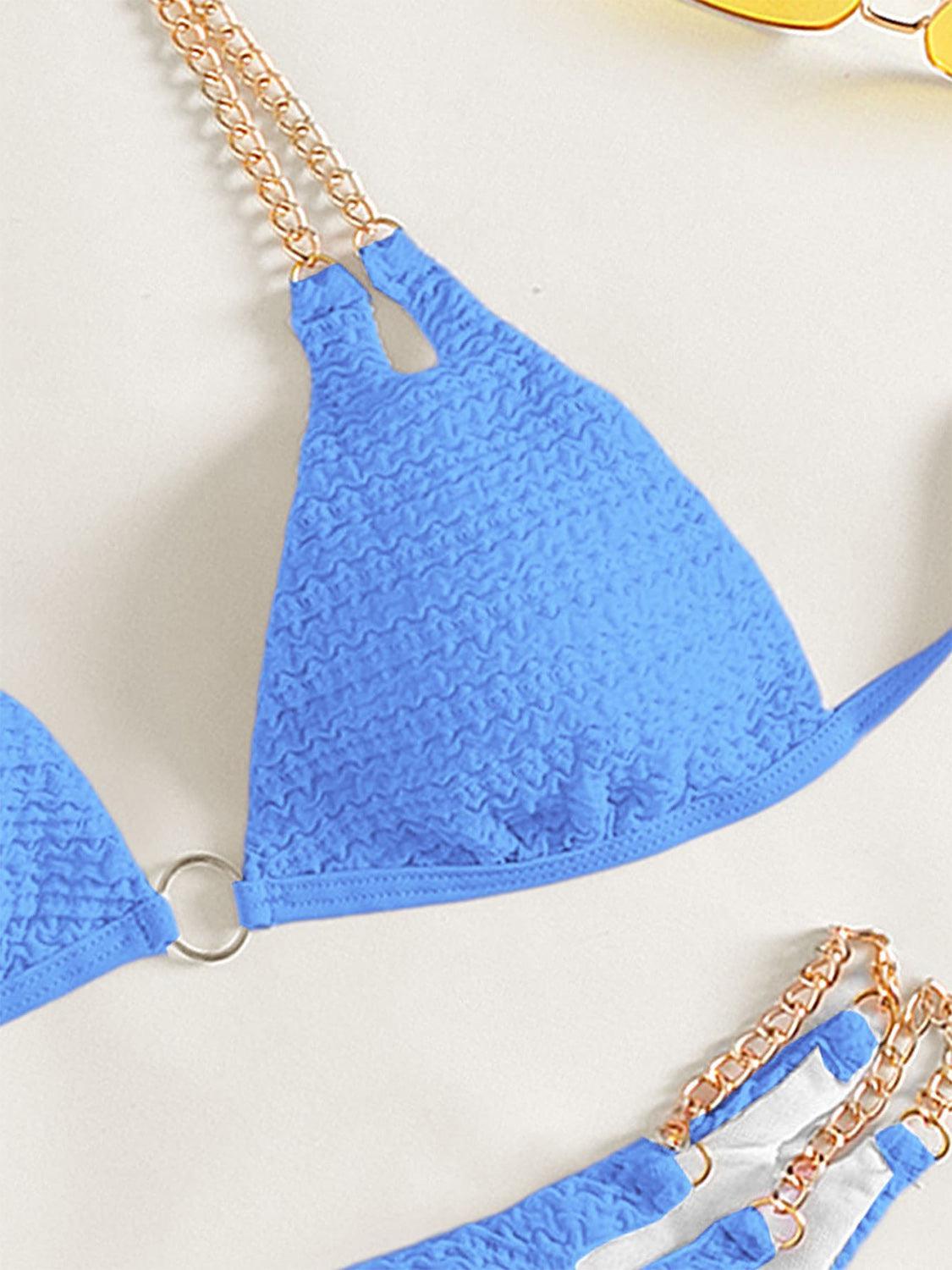 a pair of blue bikinisuits with chains on them