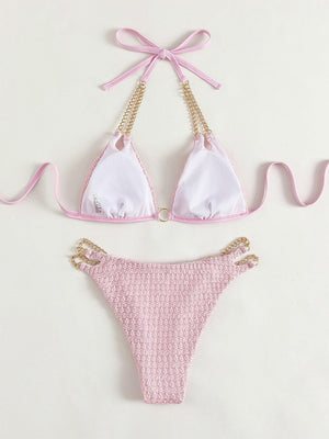 a pink and white bikini with a pink tie around it