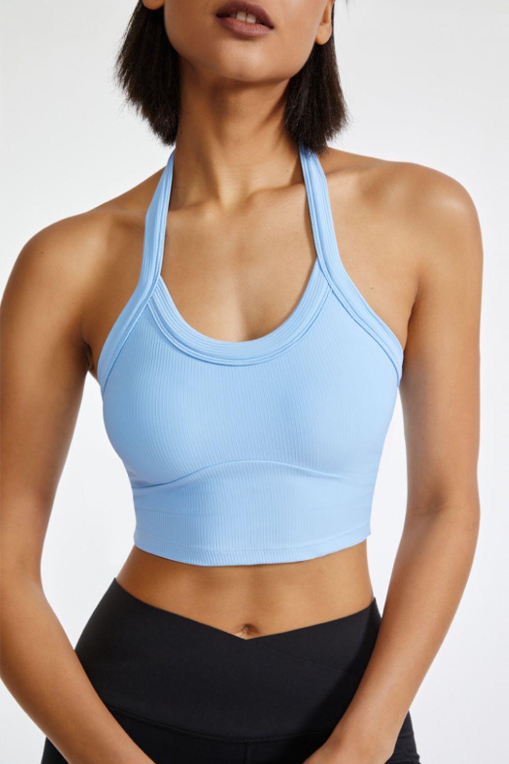 a woman wearing a blue sports bra top