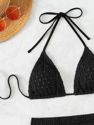 a bikini top and bikini bottom with a straw hat and sunglasses