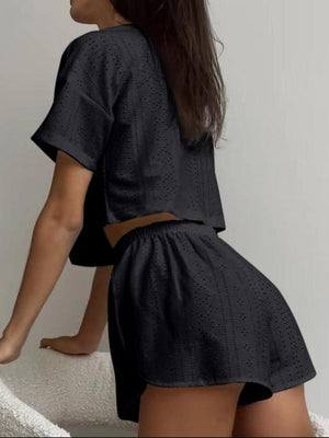 a woman standing on a bed with her back to the camera