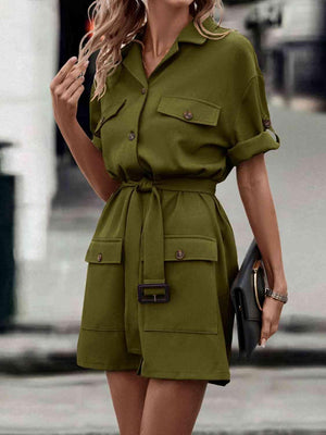 a woman wearing a green shirt dress