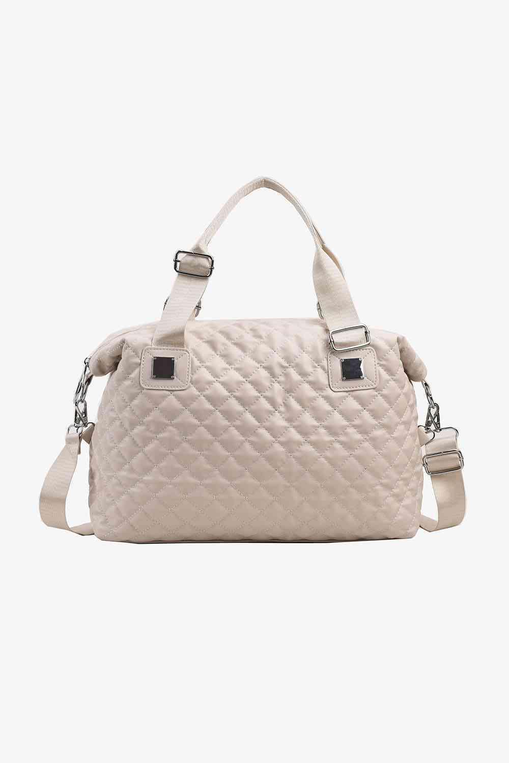 a white handbag with a strap on it