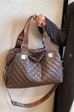 a woman is holding a brown purse