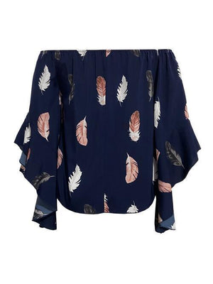 a blouse with feathers on it