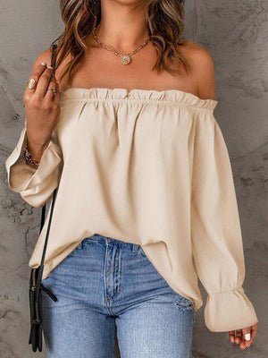 a woman wearing a off the shoulder top