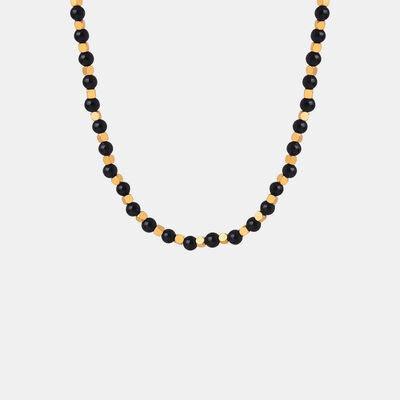 a black beaded necklace with gold accents