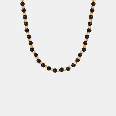 a black beaded necklace with gold accents