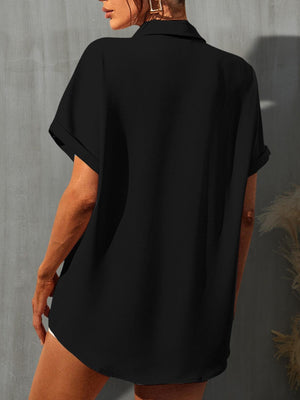 a woman wearing a black shirt and shorts