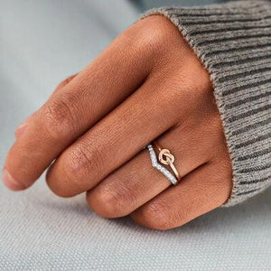 a woman's hand with a ring on it