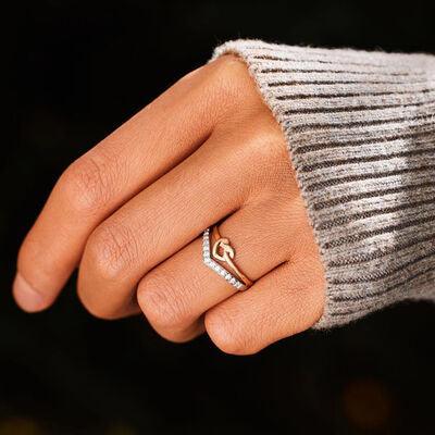 a woman's hand with a ring on it