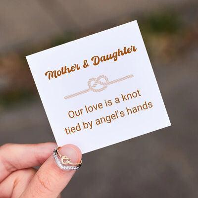 a person holding a card with a knot on it
