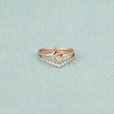 a gold ring with a heart on top of it