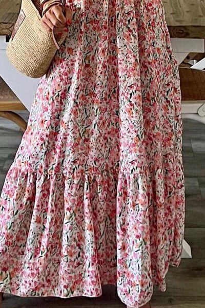 a woman in a floral dress holding a straw bag
